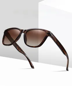 Detail of square vintage sunglasses with brown gradient lenses and wood texture frame