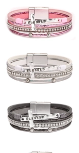 Detail view of multi-layer PU leather bracelets with crystal cross and magnetic buckle