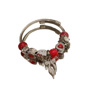 Silver stainless steel wire bracelet with red beads and cartoon kitty enamel charms