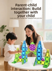 Close-up of colorful 3D magnetic tiles shaped into a castle with parent and child