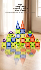 Close-up of vibrant transparent magnetic tiles casting colorful shadows on wooden floor