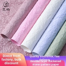 Detail view of double-layered thickened stone texture paper rolls in pastel colors