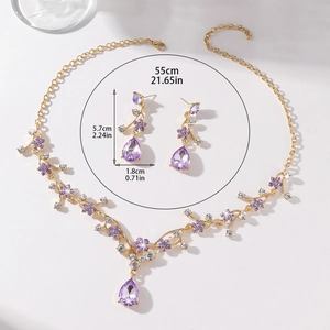 Detailed size view of purple crystal bridal jewelry set with floral vine necklace and earrings