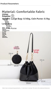 Detail view of black drawstring bucket bag set with chain strap and small round coin purse