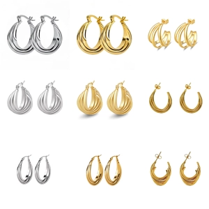 Selection of minimalist titanium steel hoop earrings in gold and silver finishes