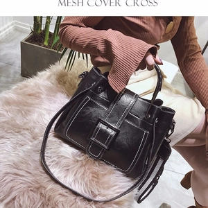 Retro black matte leather handbag with white contrast stitching and square buckle