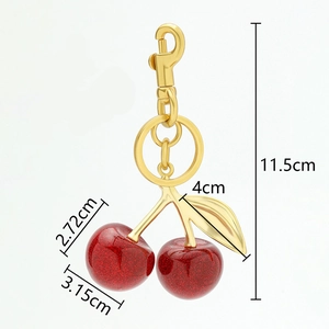 Detailed view of cherry keychain dimensions with 11.5cm length and red resin fruit