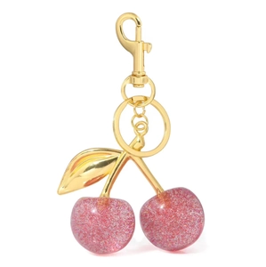 Pink glitter cherry keychain with gold leaf and metal ring on white background