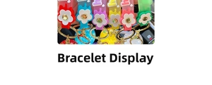 Detail of colorful silicone wristbands with daisy flowers and gold metallic rivets