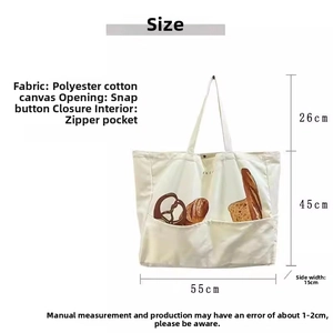 Detail view of large canvas tote bag showing press-stud closure and internal zipper pocket
