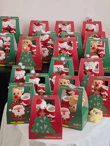 Detailed view of Christmas gift box set with ceramic mug and plush Santa reindeer doll