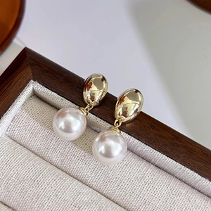Elegant French vintage gold pearl drop earrings presented in a luxury jewelry gift box