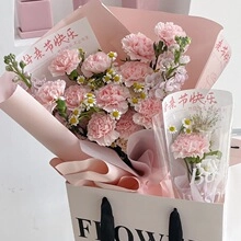 Detail of pink carnation bouquet with Happy Mother's Day card in a white gift bag