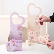 Women's Day floral gift boxes with heart-shaped handles and elegant flower patterns