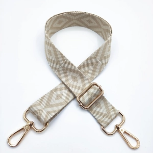 Correa de bolso ajustable bordada en beige y gris con motivos geométricos y oro