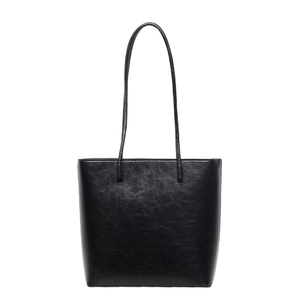 Minimalist black vintage leather tote bag with fine grain texture and shoulder straps
