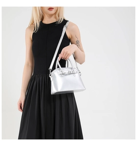 Silver mirror finish mini square handbag with metal buckle and adjustable shoulder strap