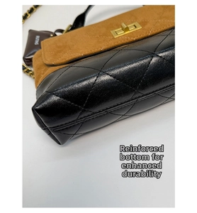 Close-up of contrast leather shoulder bag showing diamond quilting and gold twist lock