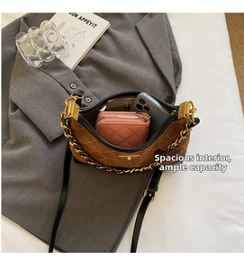 Brown suede crossbody bag with gold chain showing large interior for phone and wallet