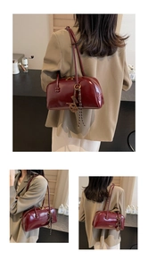 Stylish vintage burgundy tote shoulder bag shown on a model in a casual lifestyle setting