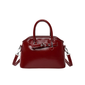 Glossy deep red shell-shaped handbag with silver hardware and detachable strap