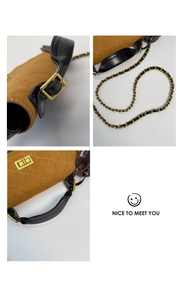 Close-up of brown suede quilting with gold twist lock and leather chain strap details