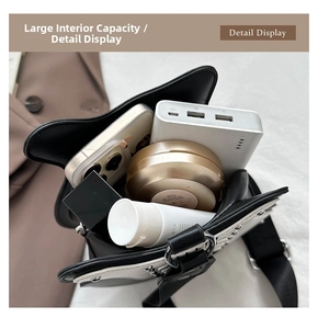 Detail view of the spacious interior of the violin-shaped bag with rivet accents