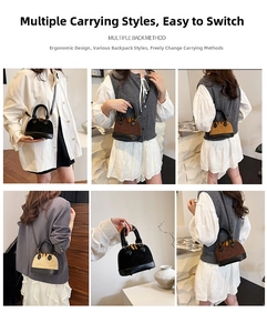 Détail d'un sac à main bicolore porté en bandoulière et à la main pour un usage quotidien
