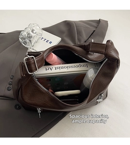 Detailed interior of large brown PU leather bag showing spacious capacity for daily items