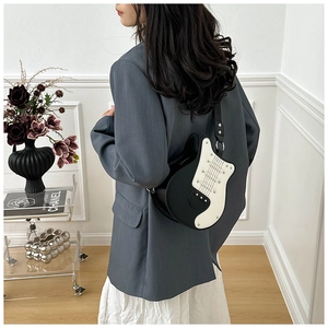 Unique guitar shaped crossbody bag for women, black and white PU leather novelty shoulder bag.