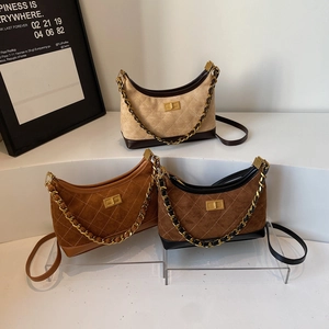 Quilted suede crossbody bags in cream, tan, and dark brown with gold chain straps