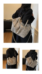 Detail view of large marble texture tote bag with adjustable straps and soft PU leather material