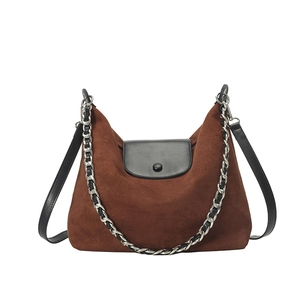 Large dark brown suede tote bag with black leather flap and silver chain detail
