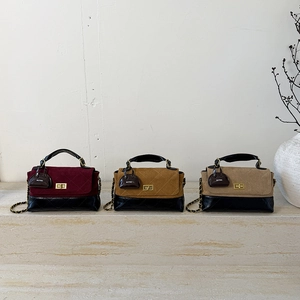 Detailed view of quilted velvet chain bags with gold turn-locks and mini bag charms