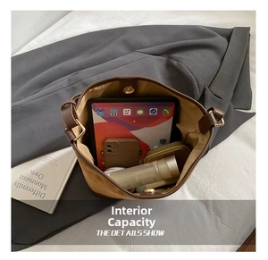Top view of brown bucket bag interior showing large capacity for tablet and phone