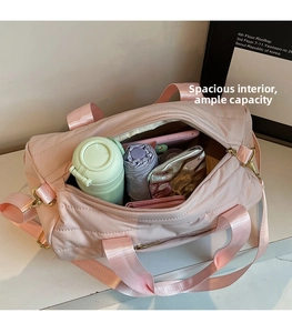 Spacious interior of light pink quilted travel bag with compartments for essentials