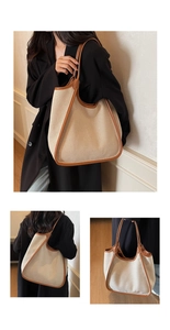 Détail du grand sac cabas en toile avec garniture en cuir brun et anses solides