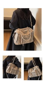 Dettaglio della grande borsa tote in finta pelle scamosciata con zip e nappe color taupe