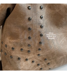 Detailed macro view of the brown twill fabric texture with dark metal rivet decorations