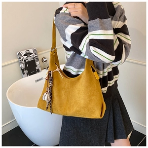 Vintage yellow suede shoulder bag for women, large capacity chic underarm hobo bag commuting.
