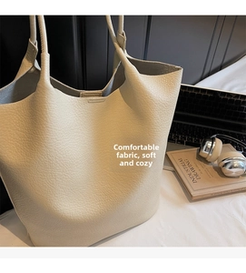 Close-up of cream white lychee leather tote bag with soft texture and large capacity