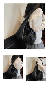 Détail d'un sac cabas en cuir noir souple avec une bandoulière à nœud épais unique