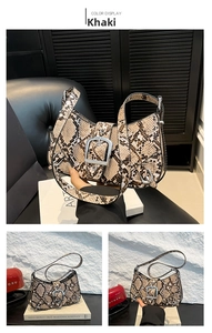 Detail of snake print crescent handbag in khaki with a large silver belt buckle