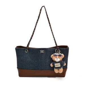 Retro denim patchwork tote bag with brown leather trim and metal chain strap