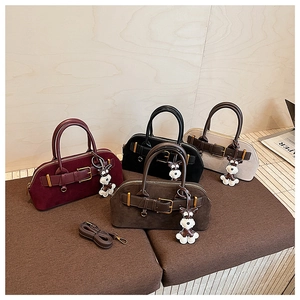 Suede shell handbags in burgundy, black, beige, and coffee with schnauzer charms