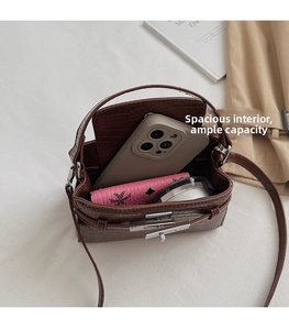 Interior view of brown crocodile pattern handbag showing space for phone and wallet