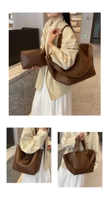 Macro detail of brown leather bucket tote bag set including inner pouch and wide strap