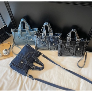 Macro detail of four assorted denim handbags featuring metal buttons and decorative pockets