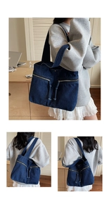 Detail of blue denim tote bag featuring dual front zipper pockets and tassel drawstring