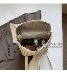 Detail view of woven backpack interior with striped design and large storage capacity